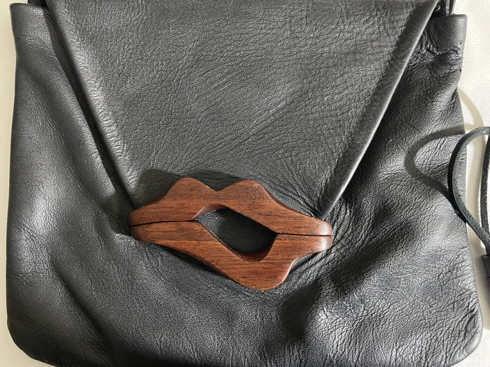 Hand Carved Medium Lip Bag (S) by artist Kimberly Chalos