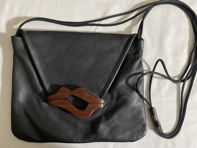 Hand Carved Medium Lip Bag (S) by artist Kimberly Chalos